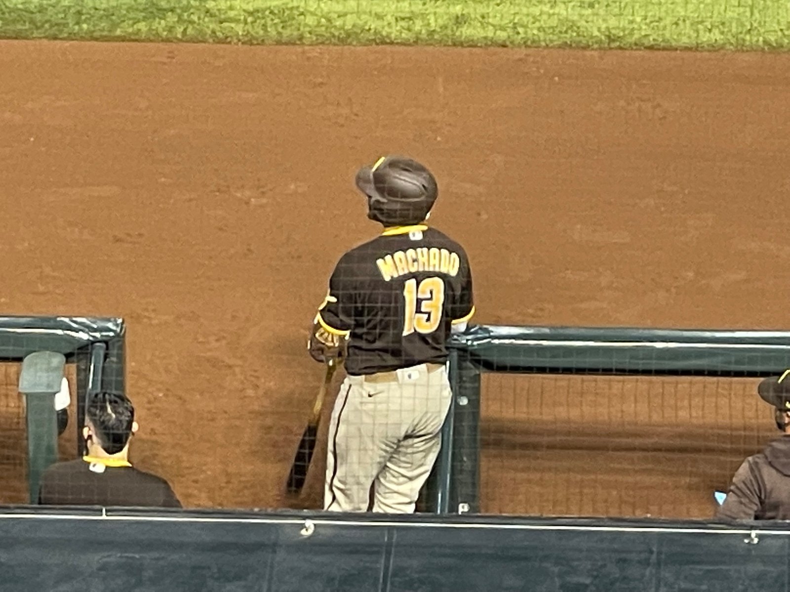 Machado number 13 beside the dugout
