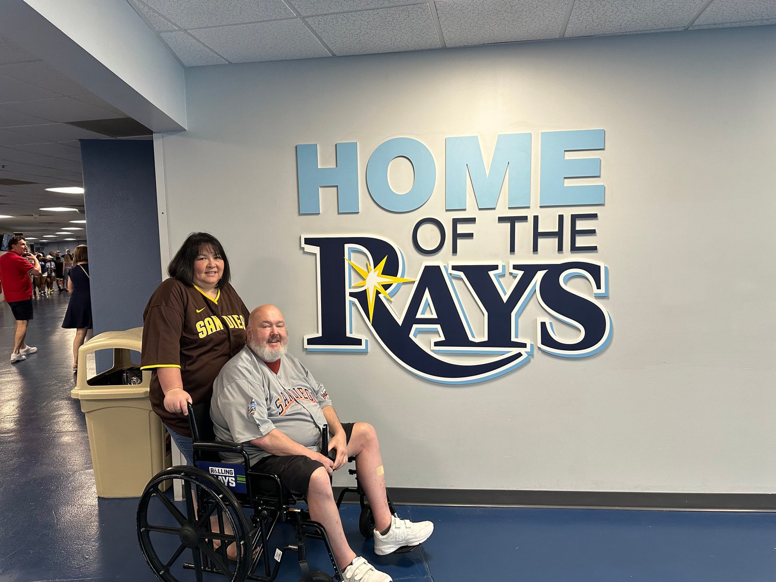 Together beside the Home of the Rays sign